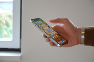 man holding mobile phone app