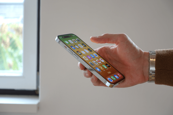 man holding mobile phone mobile app